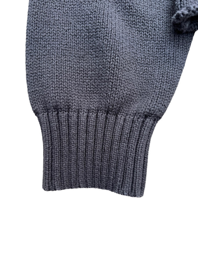 Detail shot of Hypnotic Clothing ‘Lost in the Matrix’ sweater sleeve cuff and ribbed knit texture.