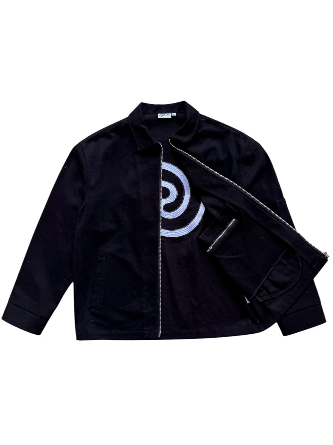 Front view of the Hypnotic Clothing Lucien black work jacket with one side open to show the inner pocket, modern streetwear detail shot.