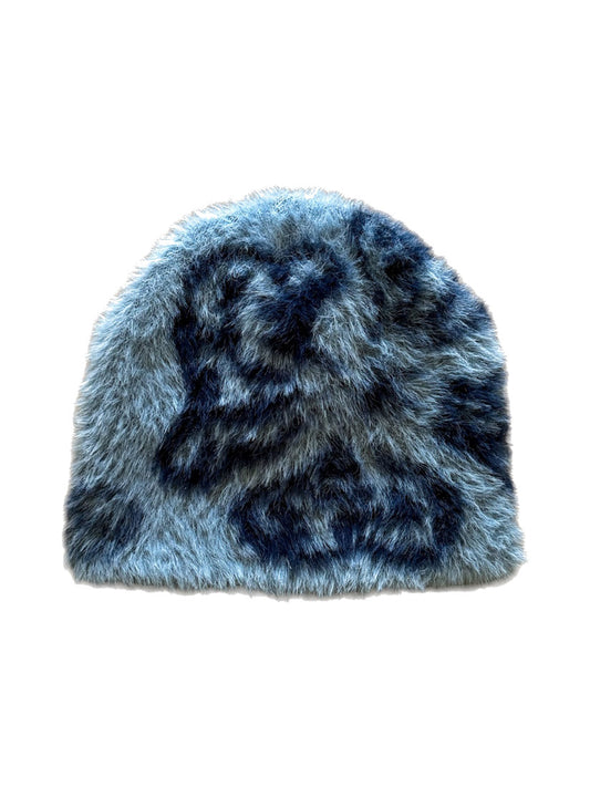 Flat lay of the Hypnotic Clothing Magnate blue mohair knit beanie with abstract pattern, modern streetwear accessory.